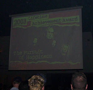 the video tribute begins. Photo by Lanny Pizzingrilli.